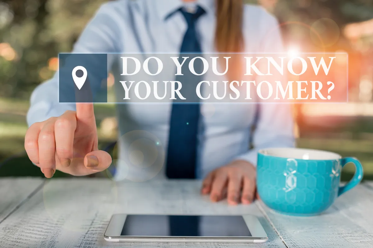 A shop owner talking with a customer, representing knowing your customer