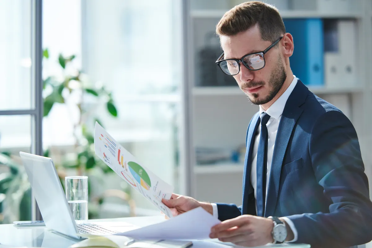 A finance director reviewing financial papers