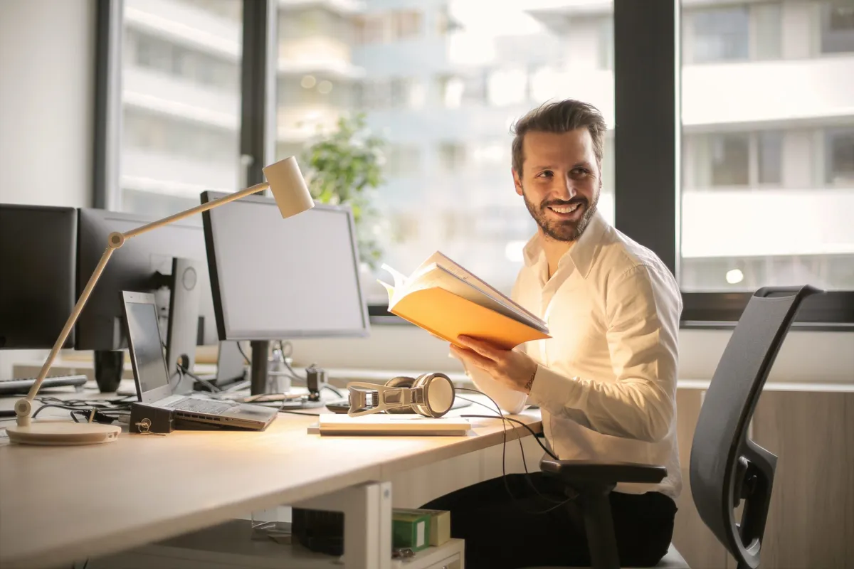 A man working at a computer in an office